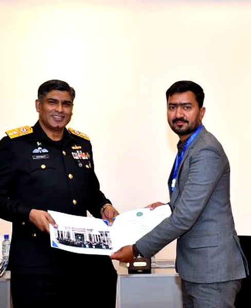 Certificate presentation by military officer, IDEAS 2024 Karachi